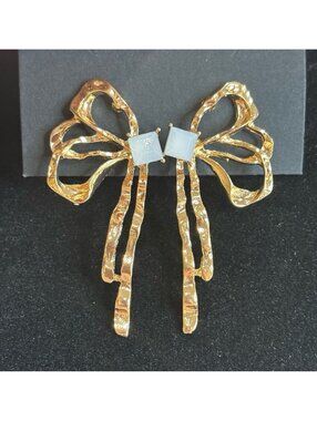 Gold Tone Bow Shaped Earrings with Square White Accent